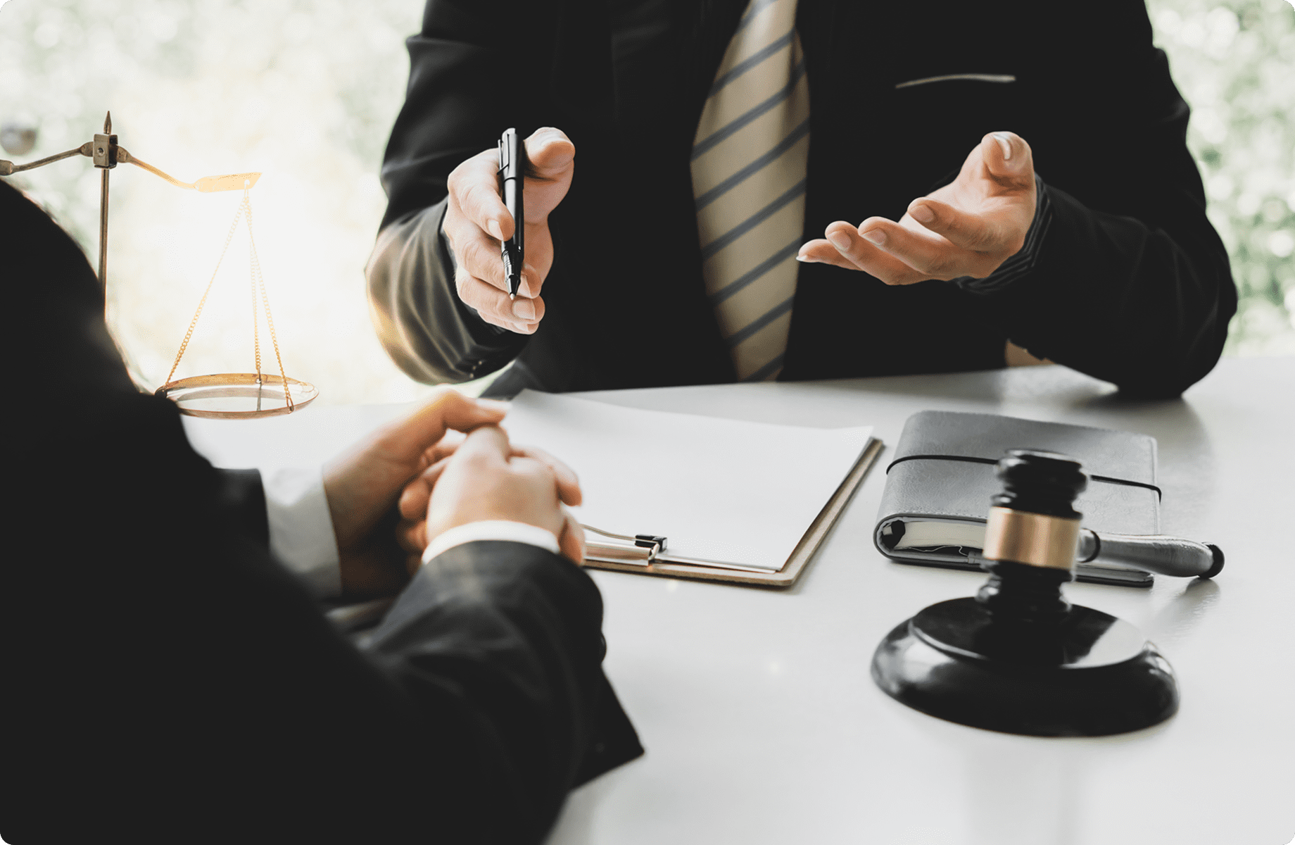 Business meeting with legal documents and gavel