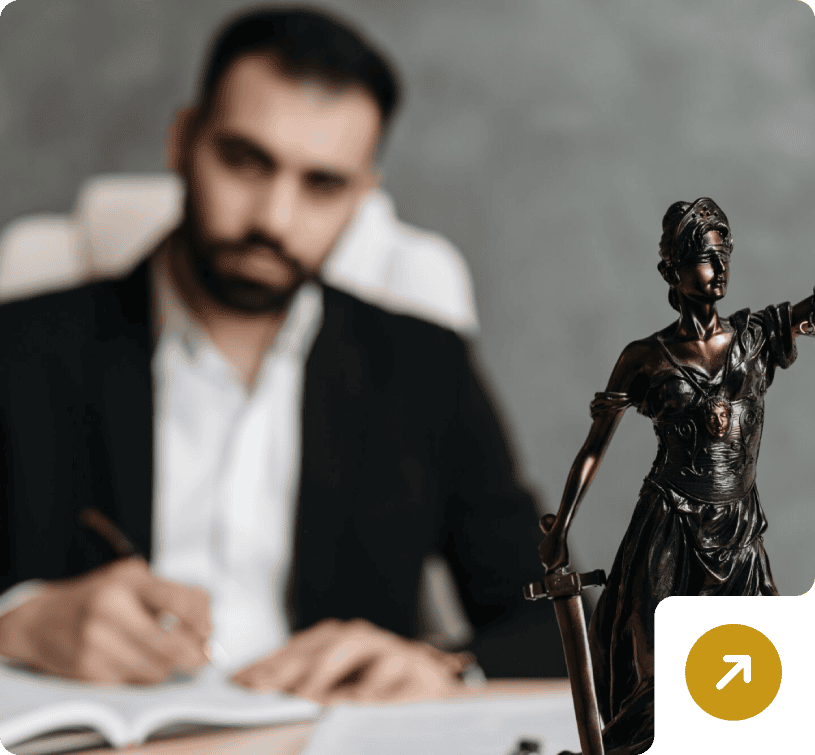 Lawyer writing near Lady Justice statue