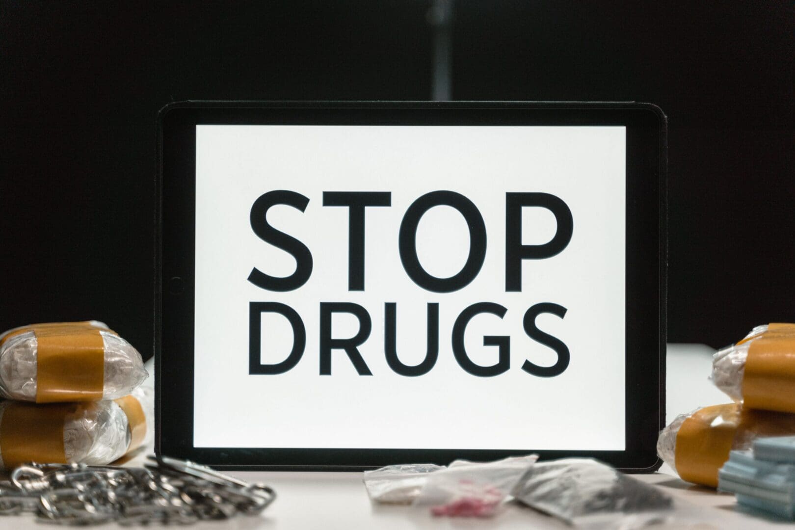 Tablet showing stop drugs message