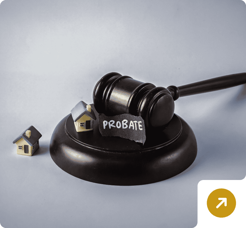 Probate concept with gavel and miniature houses
