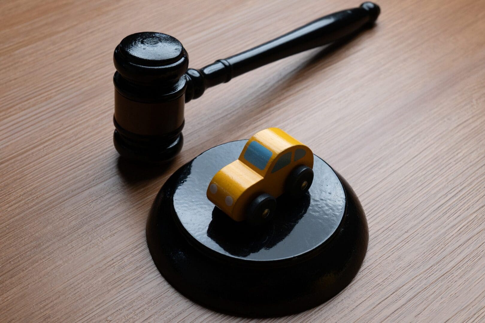 Justice symbol with small car and gavel